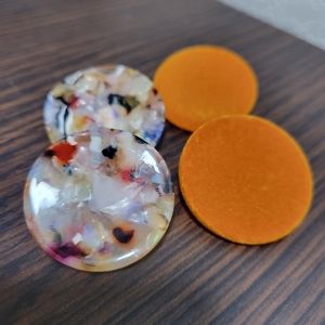 Two pair of round stud earrings